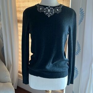 Cashmere sweater with crystal embellishments.